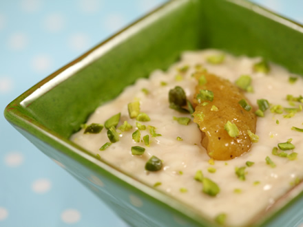Coconut Milk Rice Pudding with Mango Cardamom Sauce — A Vegan Exotic Delight Almost as I imagined it—creamy risotto-style rice pudding made with coconut milk for a luscious vegan twist. Since I forgot to buy coconut flakes for toasting, I improvised with roasted pistachios instead—still delicious! The mango sauce with a hint of pineapple and fragrant cardamom perfectly complements this exotic dessert. 🍚 Ingredients (Serves 2) Rice Pudding Ingredient Quantity Round-grain rice (Arborio) 100 g Light coconut milk (not the thick cream on top) 650 ml Brown sugar 3 tablespoons Coconut oil (or butter) 1 tablespoon Mango Sauce Ingredient Quantity Ripe mango 1 Pineapple cube (optional) Size of a small sugar cube Brown sugar 2 heaping teaspoons Ground green cardamom A pinch Cornstarch (optional) ½ teaspoon 🔪 Preparation Steps Mango Sauce Peel mango and remove the seed. Blend mango flesh and pineapple cube in a small blender until smooth. Add brown sugar and simmer over low heat for 5 minutes. For thicker sauce, dissolve cornstarch in a tablespoon of cold water and stir into the sauce. Cook 1 more minute until thickened. Stir in ground cardamom. Refrigerate until ready to serve. Can be made a day ahead. Rice Pudding Heat coconut milk in a small pot until warm. Melt coconut oil in a saucepan. Add rice and toast for 1 minute, stirring constantly. Reduce heat to medium-low to maintain a gentle simmer. Add coconut milk ladle by ladle, stirring slowly and continuously until each ladle is absorbed before adding the next. This slow absorption creates creaminess. Continue for 20–25 minutes until rice is tender and creamy. Add sugar with the last ladle of milk. Check for doneness. Serve pudding warm immediately (pudding loses creaminess as it cools) with mango sauce. Garnish with toasted coconut flakes or roasted pistachios, finely chopped. 💡 Tips & Serving Suggestions Use light coconut milk (the more liquid part) to keep the pudding creamy but not too thick. Slow stirring and gradual milk addition are key for perfect risotto-style texture. Mango sauce’s tropical flavors and cardamom’s subtle spice make a beautiful contrast. Toasted pistachios or coconut flakes add crunch and richness. 🧾 Final Thoughts This vegan coconut milk rice pudding with luscious mango cardamom sauce is a decadent, creamy, and exotic treat that’s easy to prepare and perfect for a refreshing dessert or brunch.