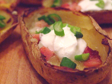 LOADED BAKED POTATO SKINS WITH BACON, CHEESE, AND GARLIC CREAM