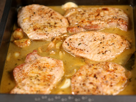 QUICK OVEN-BRAISED PORK CHOPS WITH GARLIC AND HERBS