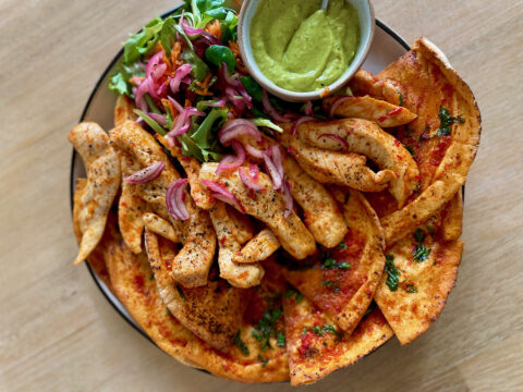Spicy Garlic Chicken Wraps with Avocado Cream & Pickled Onion Salad